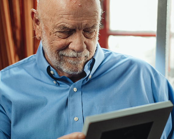 resident looking at picture of loved one