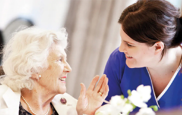 resident and carer chatting