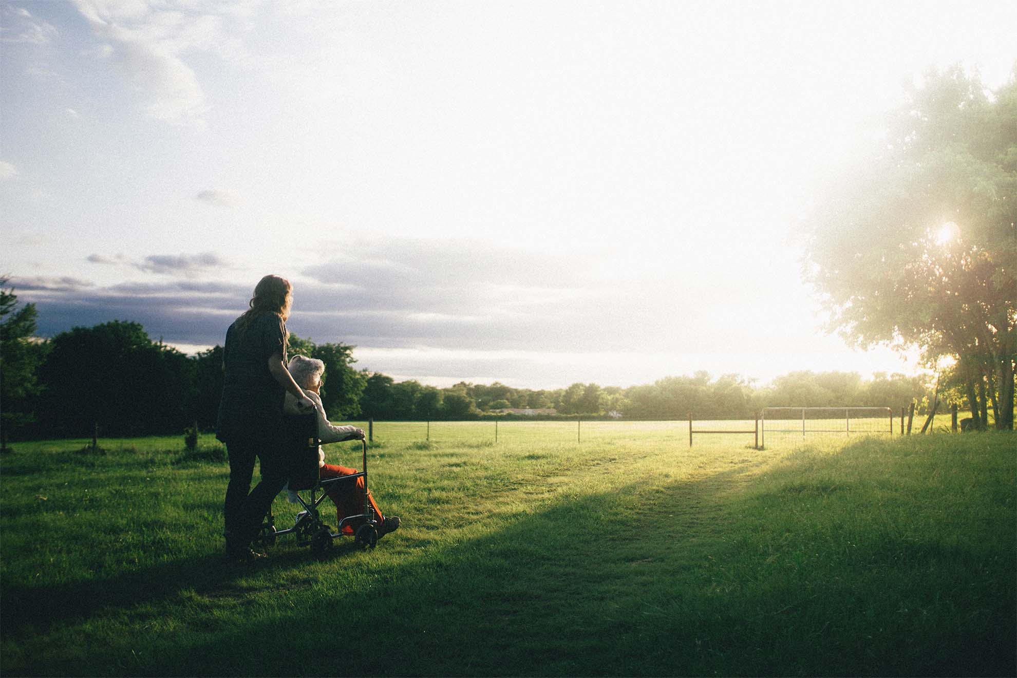 resident on a walk with a carer