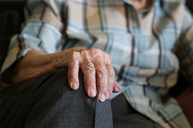 resident with hand on their knee