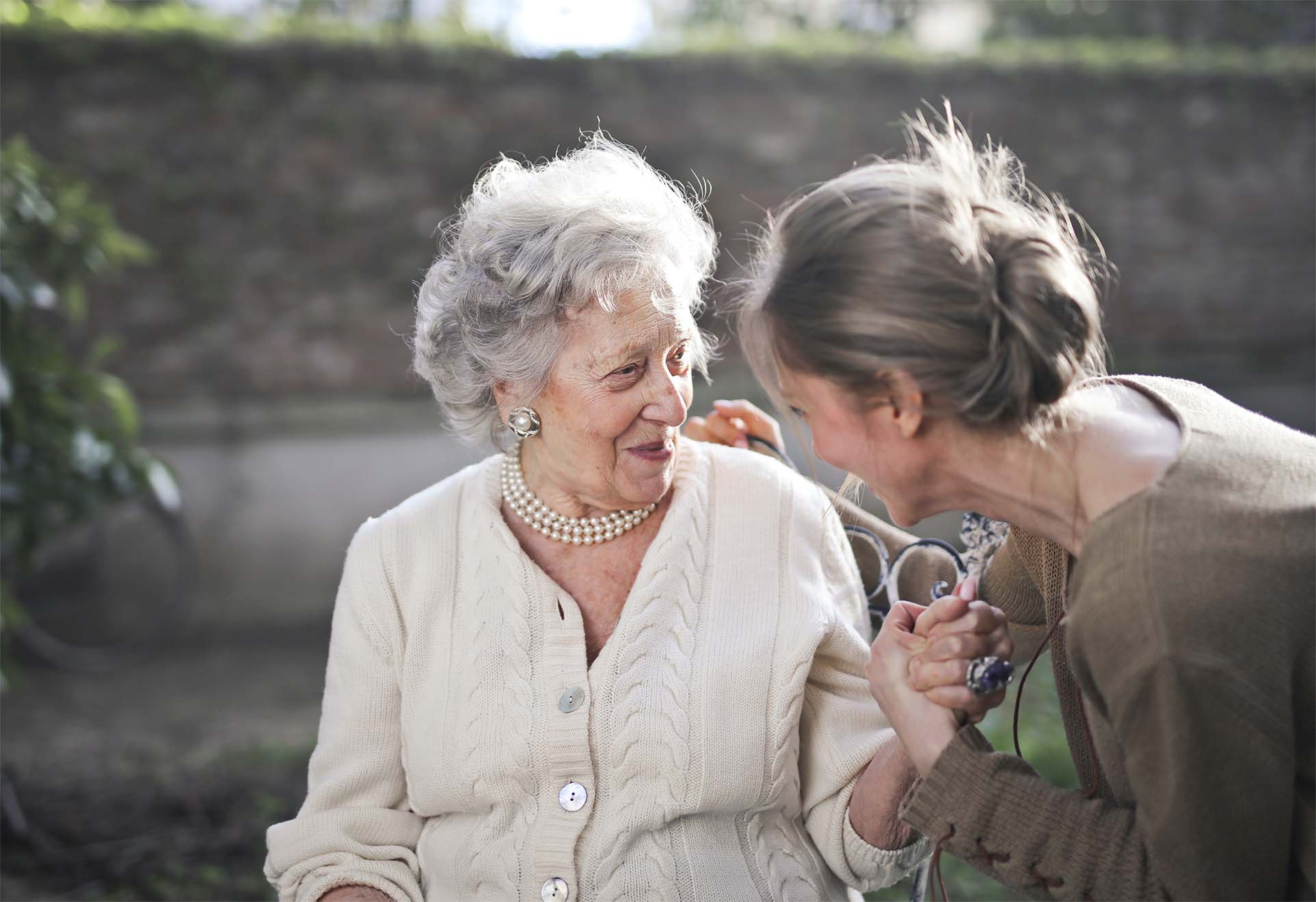 resident and loved one chatting outside