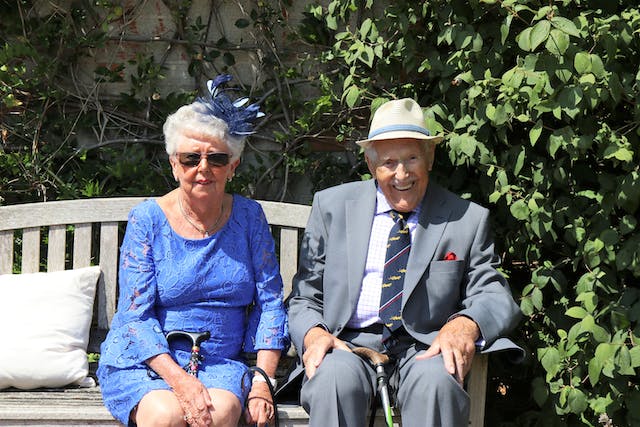 residents sat on a bench outside together