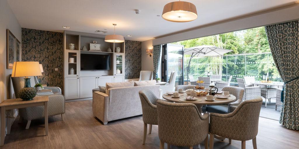 lounge with dining area and balcony