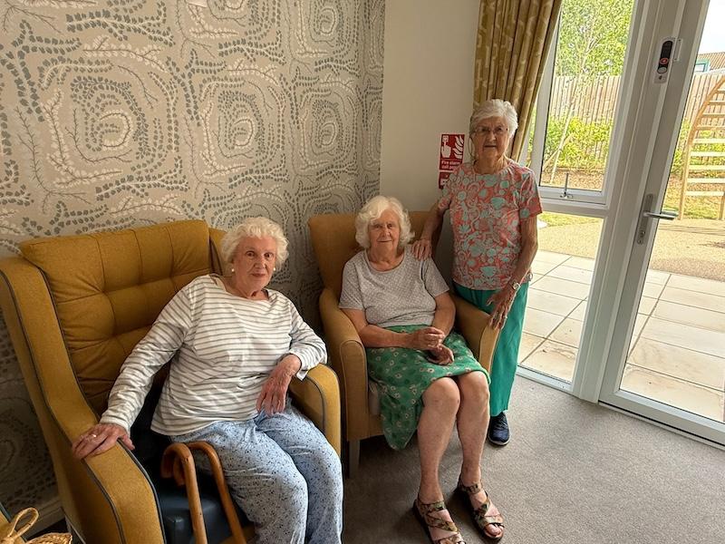 female residents sat in the lounge together