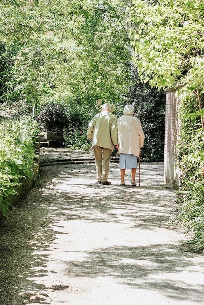 residents walking through the woods together