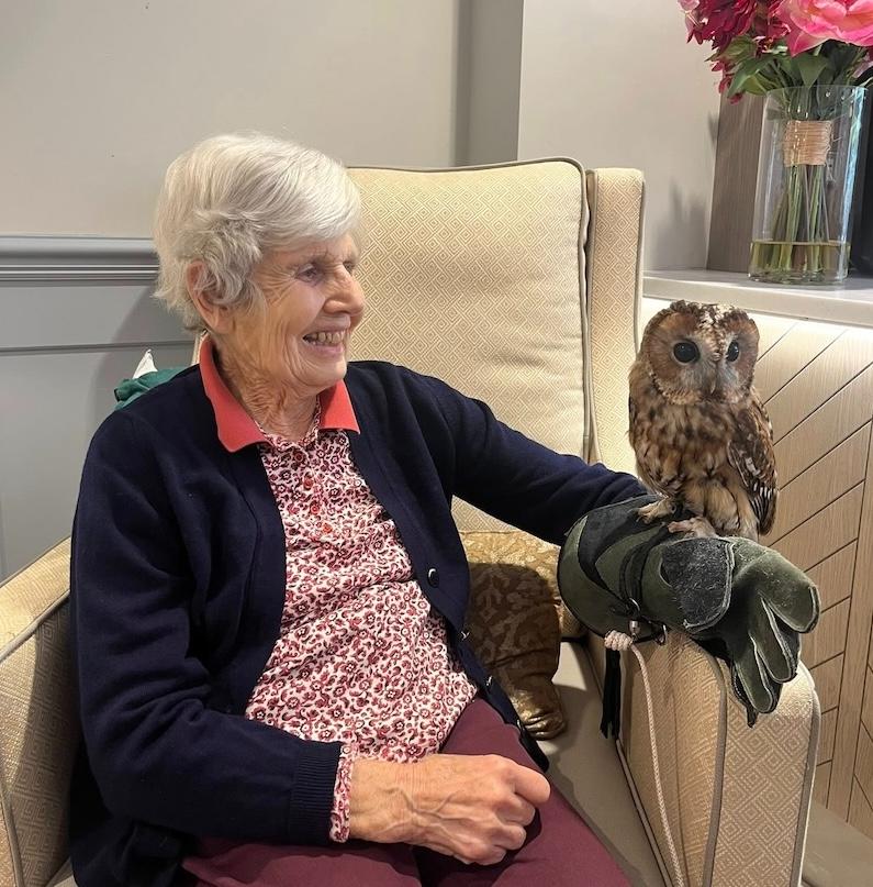 one of our residents holding an owl
