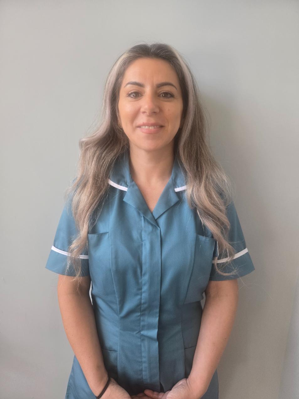 lady smiling at camera for staff photo