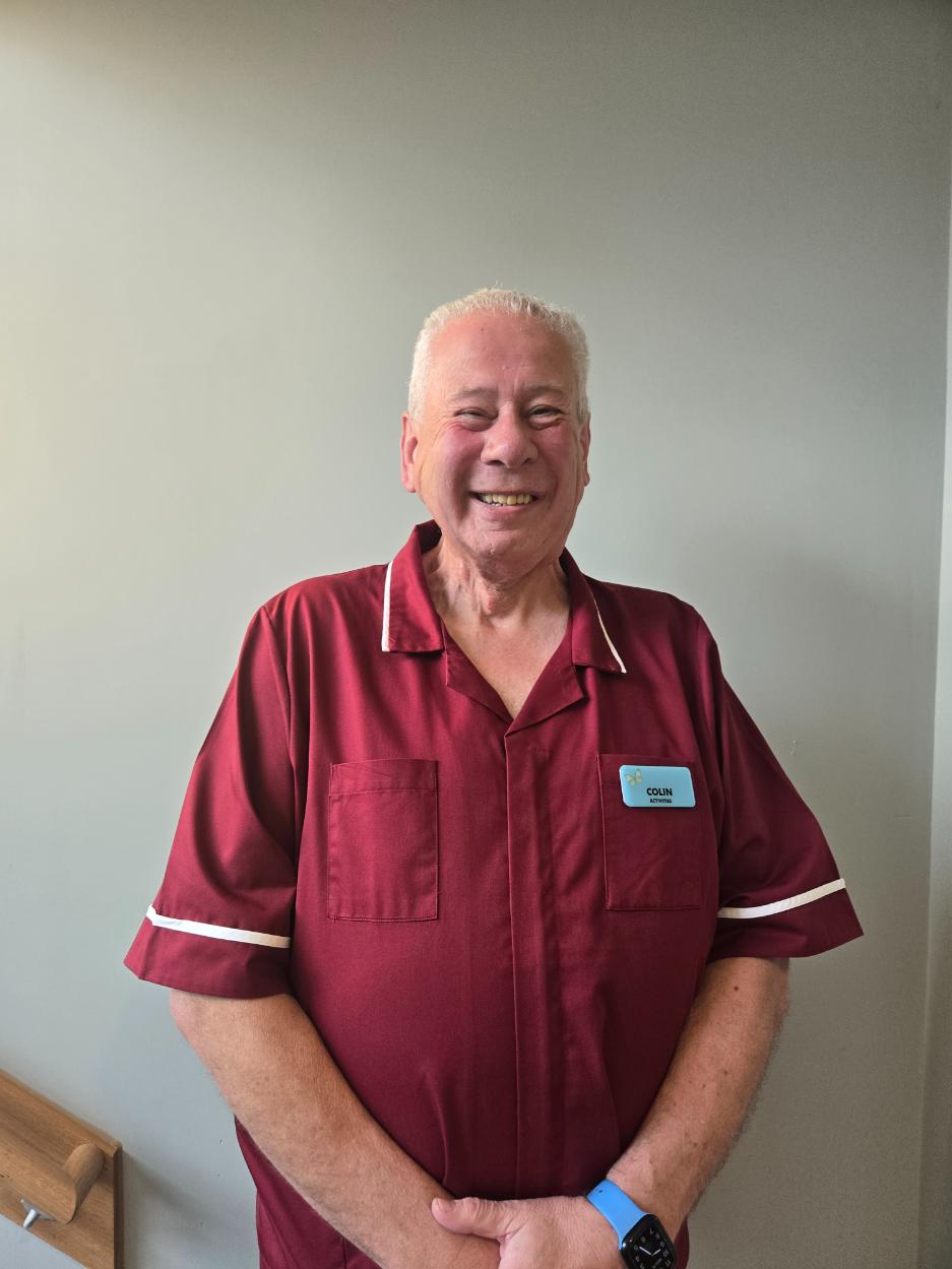 man smiling at camera for staff photo