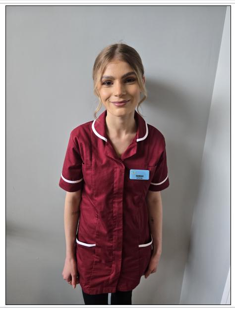 lady with blonde hair posing for staff photo