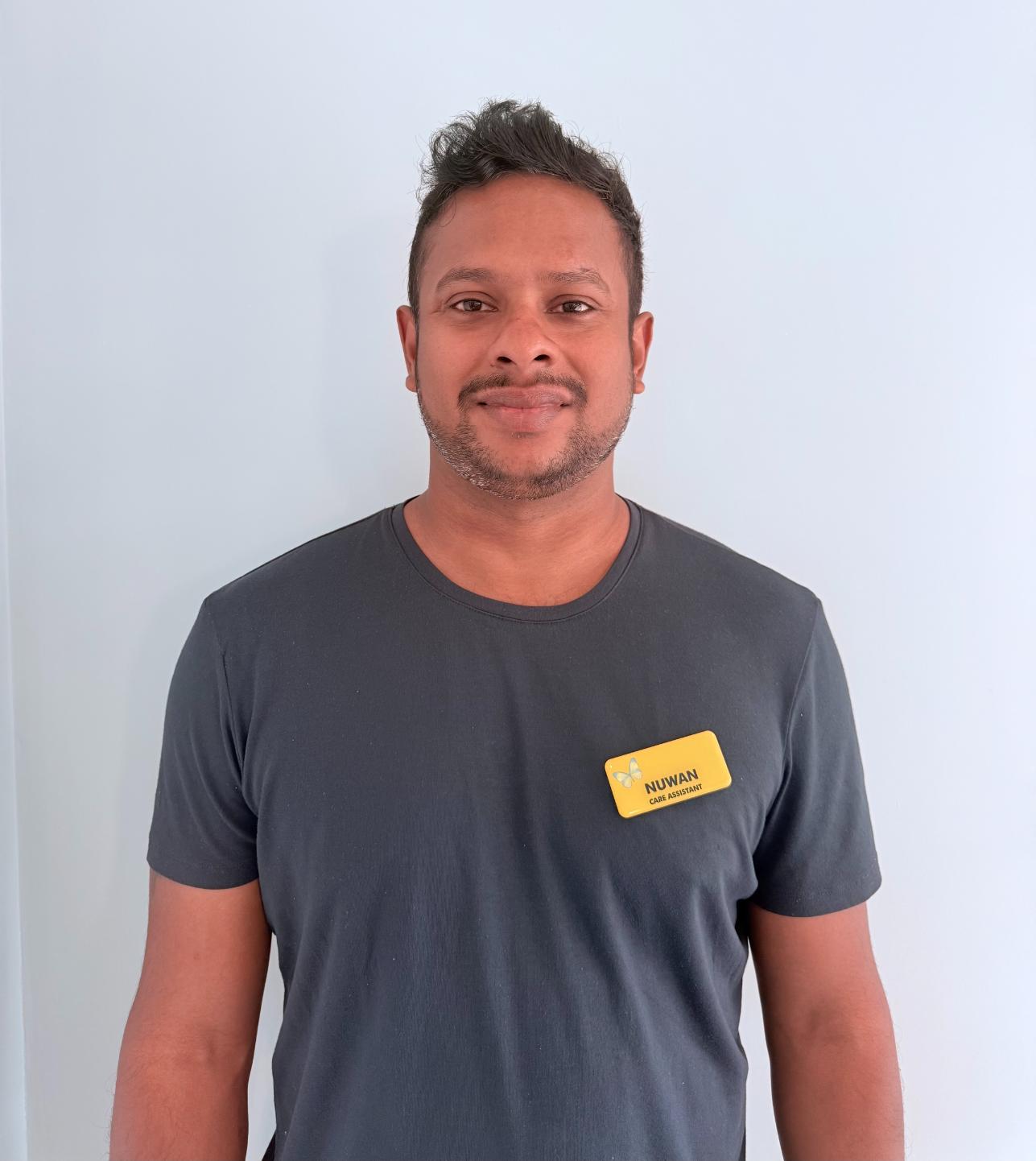 man standing for staff photo