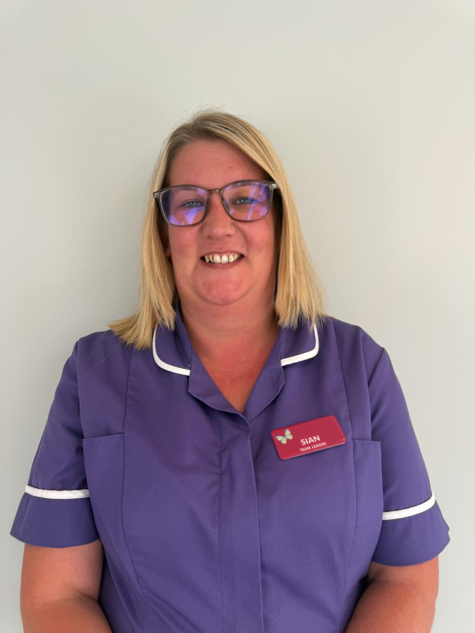 woman standing for staff photo