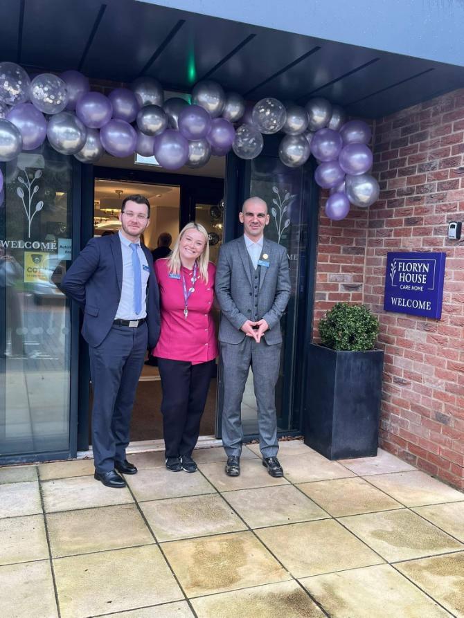 team members outside floryn house
